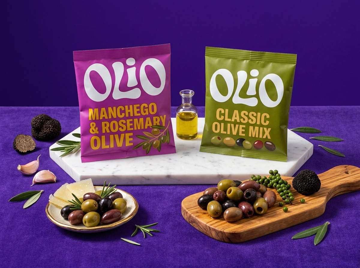 Manchego & Rosemary olive pouch hero shot on a marble and walnut riser